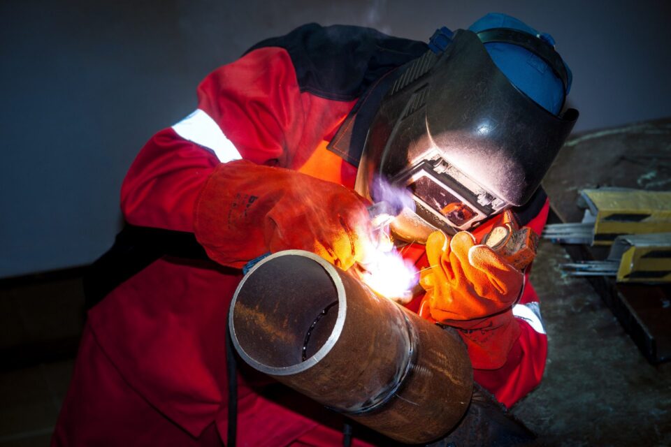 Welder working on a pipe